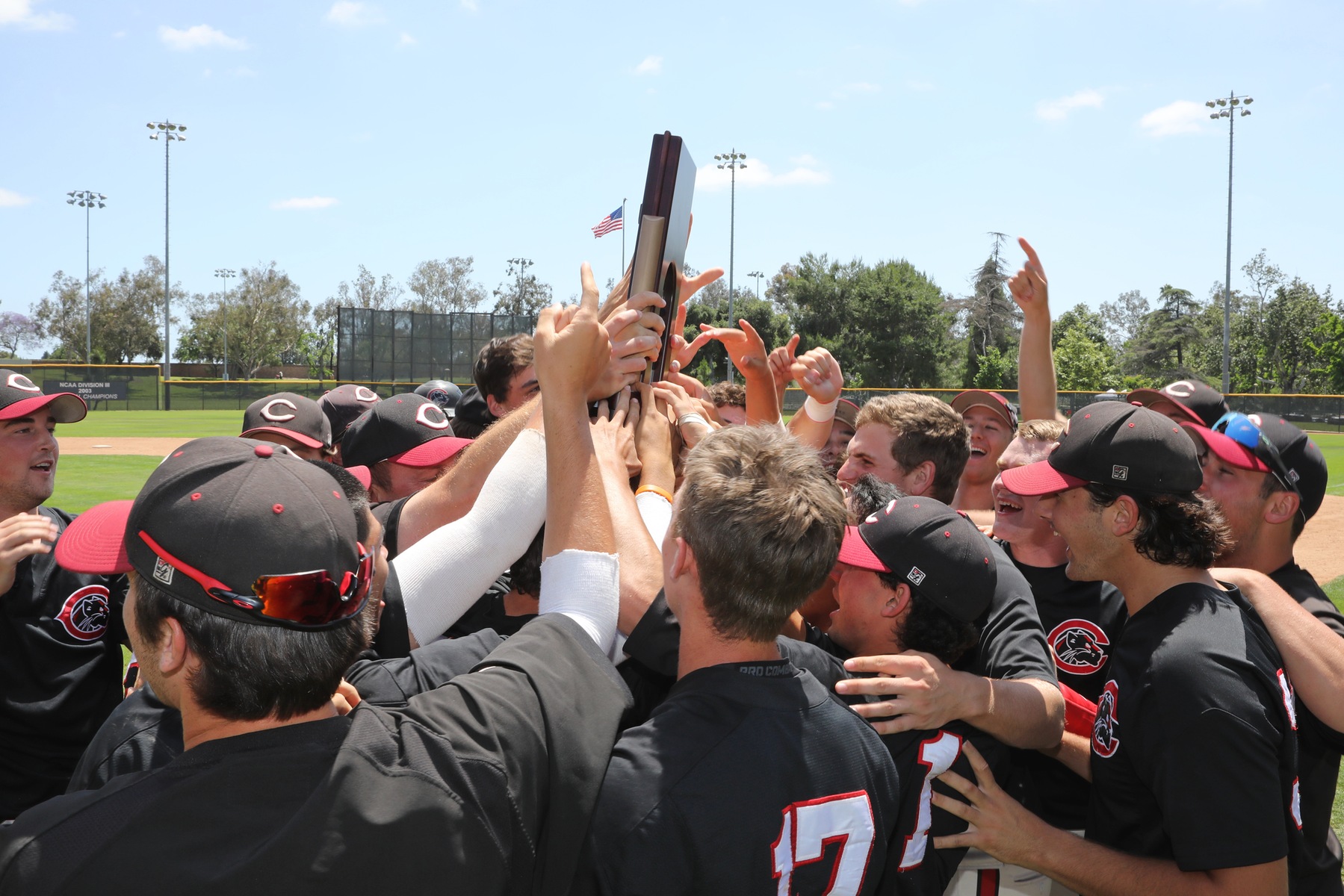 The Chapman baseball team holds up the Super Regional trophy.