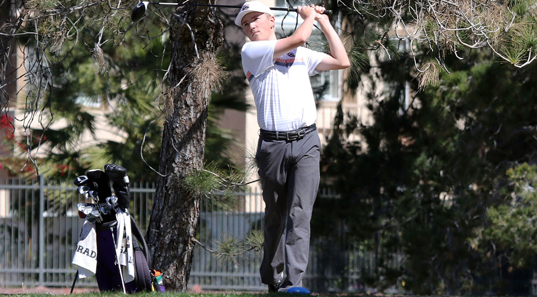 Avery Keating swings the golf club.