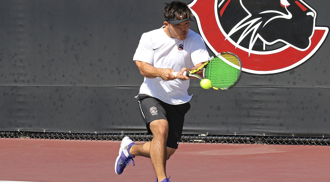 Terry Kang smashes a backhand.