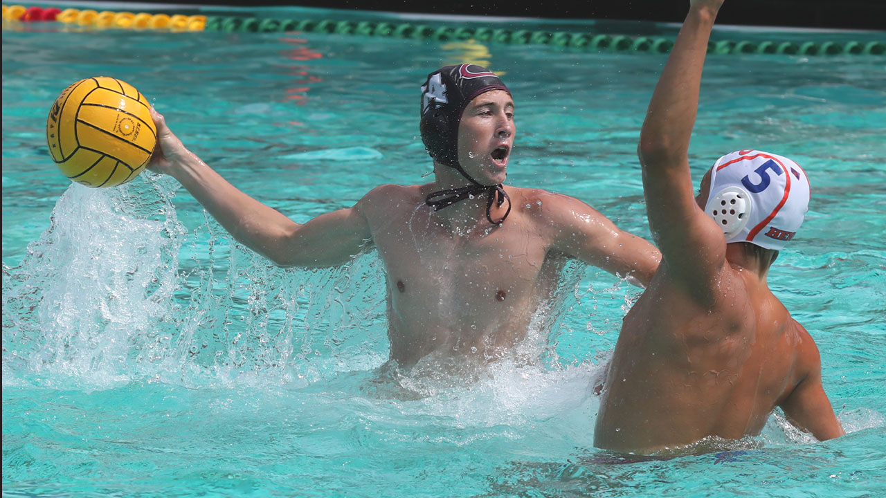 Everett Prussak shoots in water polo.