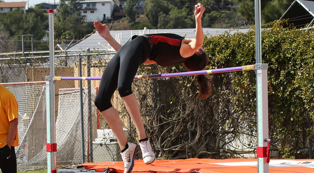 Gina Pasquinelli clears the high jump bar.