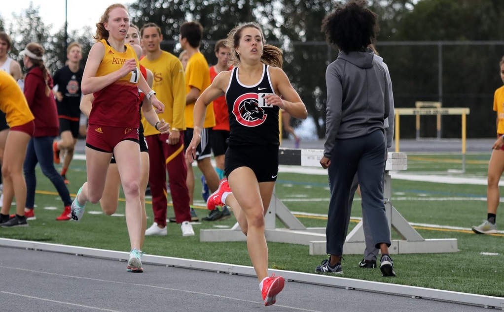 Maddie Mirro runs ahead of her competitor.