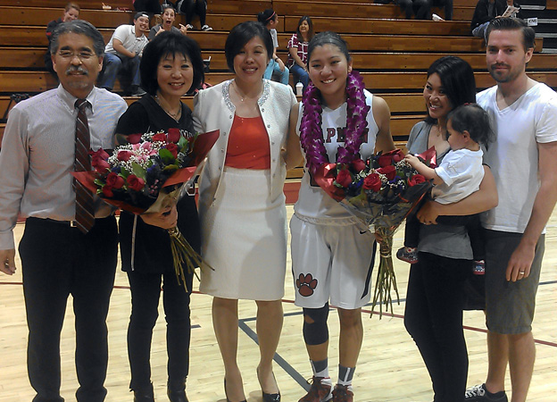 Kimi Takaoka (center) is honored on Senior Night