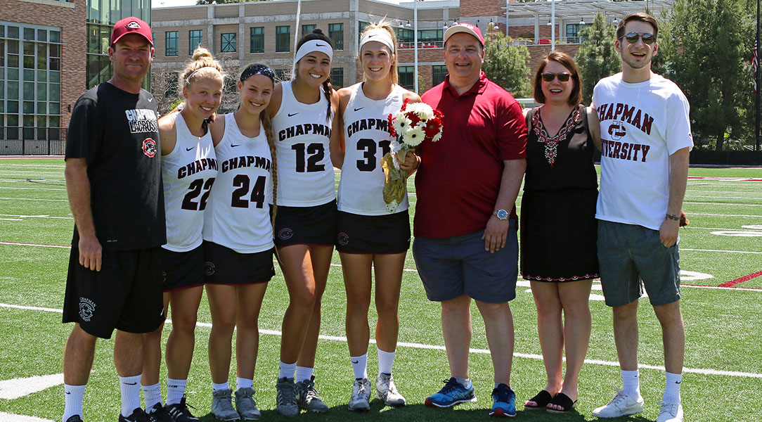 Stacey Zuppa poses with her teammates and family on senior day.