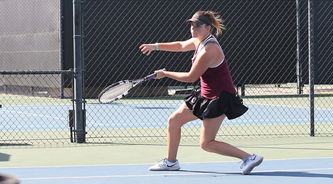 Nicole Fouts hits the ball.