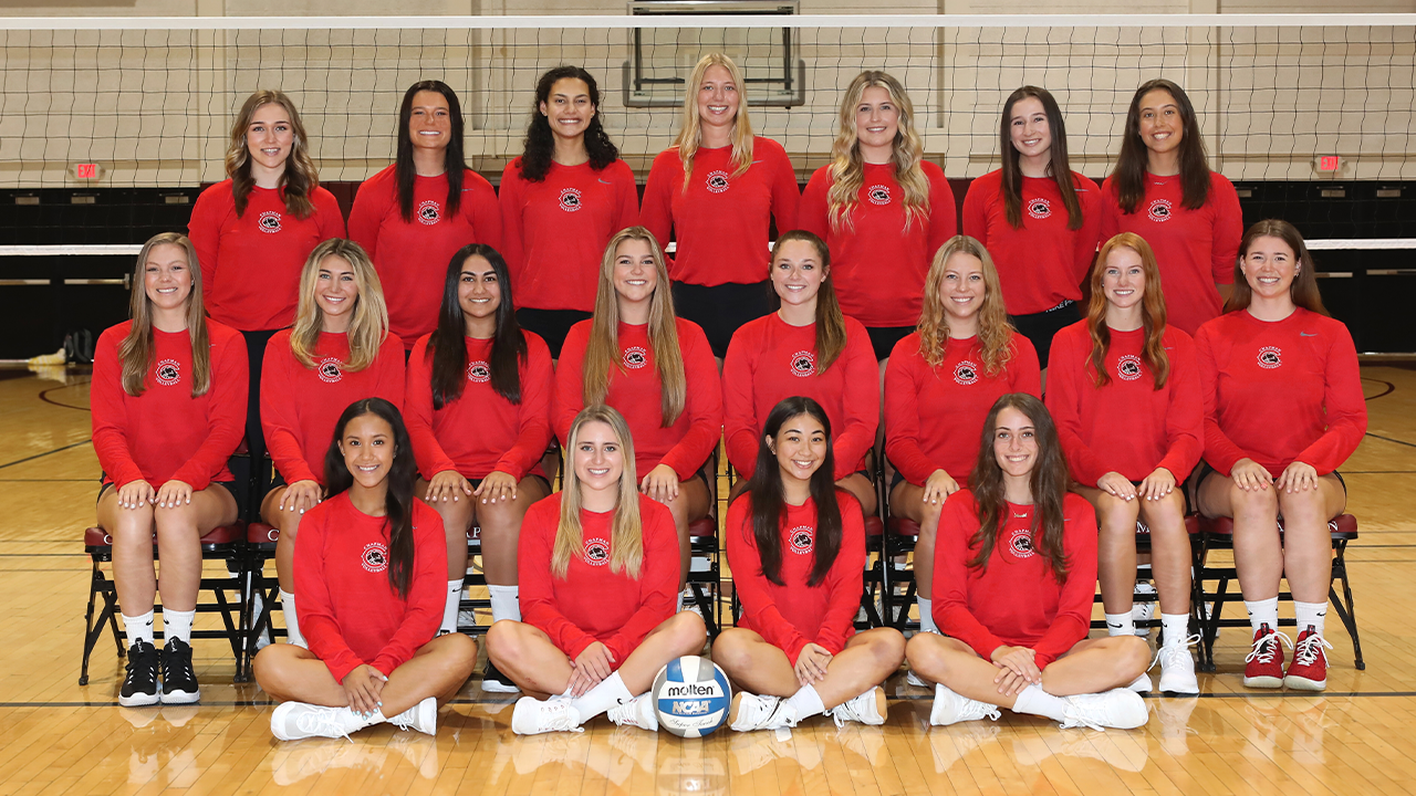 Women's volleyball poses for team photo