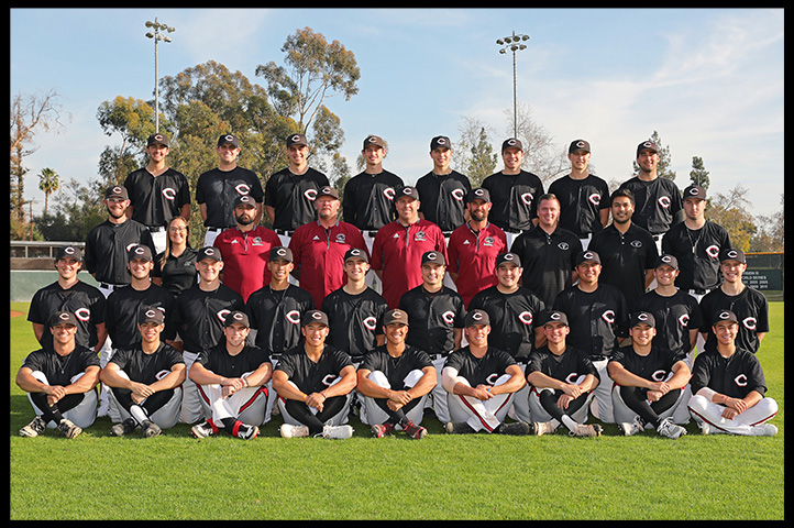 The baseball team and coaches pose for a team photo.