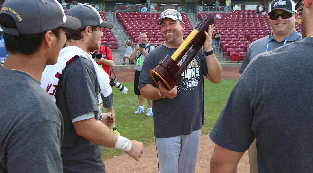 Scot Laverty holds the national championship trophy.