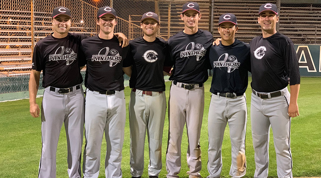 The seniors on the baseball team pose for a photo.