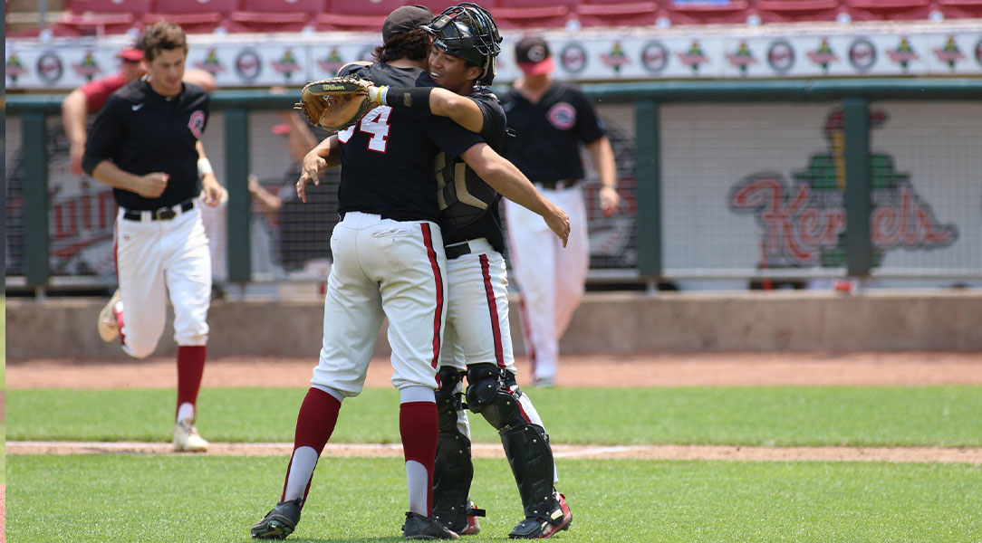 Joe Jimenez hugs Nick Garcia after a win on the baseball field.