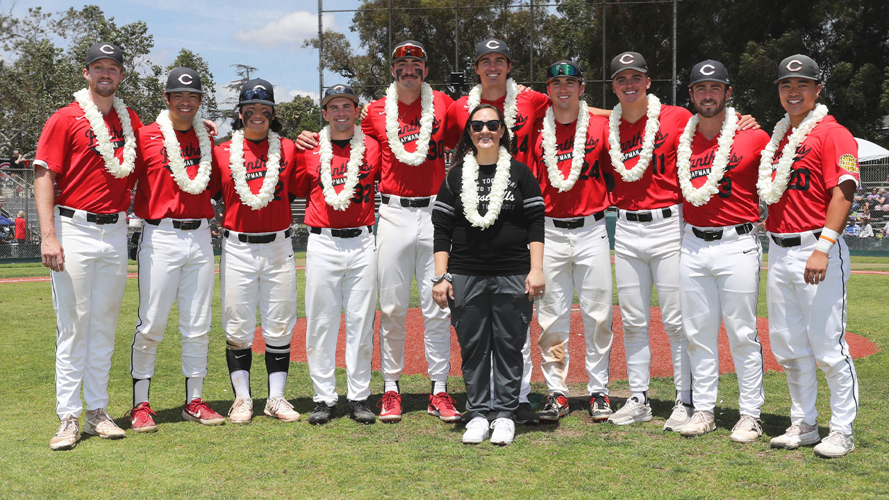 The 10 baseball seniors stand with their athletic trainer.