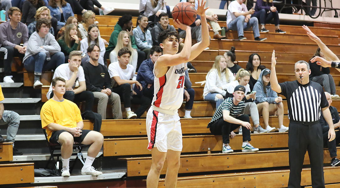 Hayden Moore shoots the basketball.