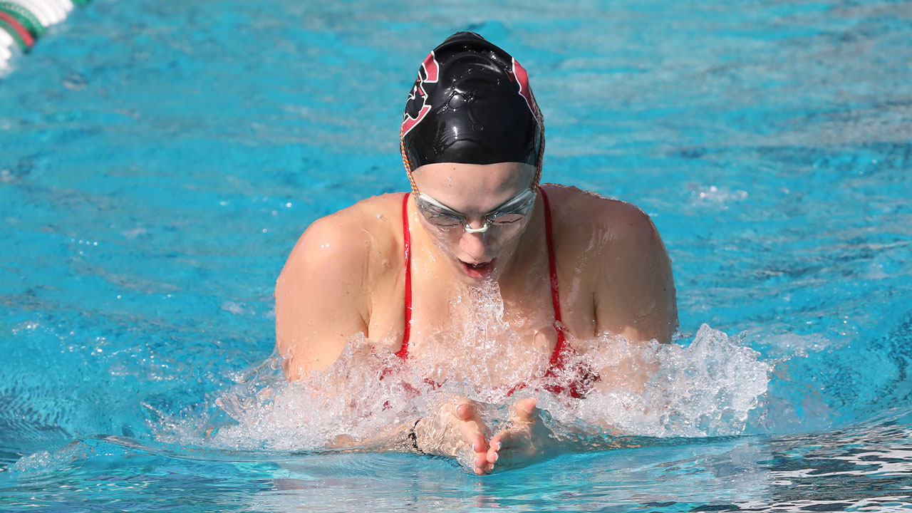 Avery Hall swimming the breaststroke.