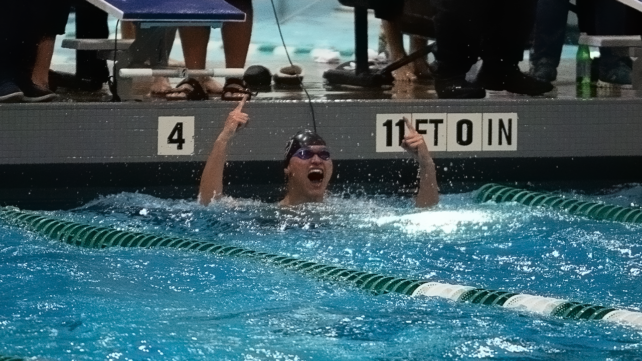 Cole Kershner celebrates victory in 50 freestyle.