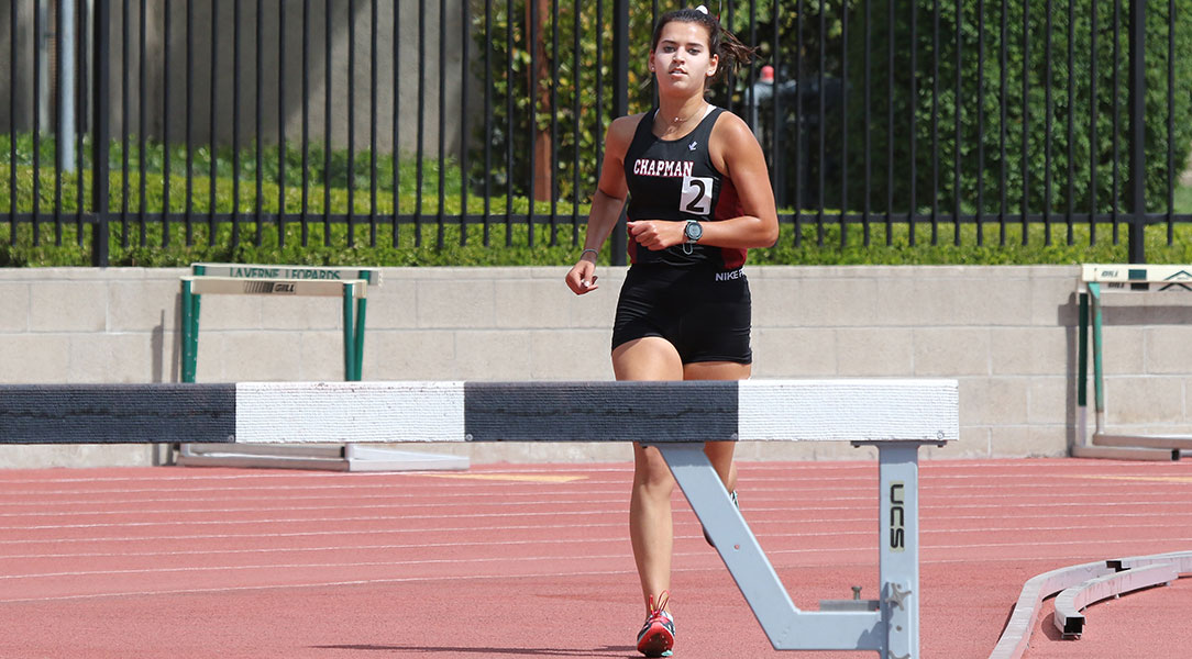 Emma Eglinton approaches a steeplechase hurdle.