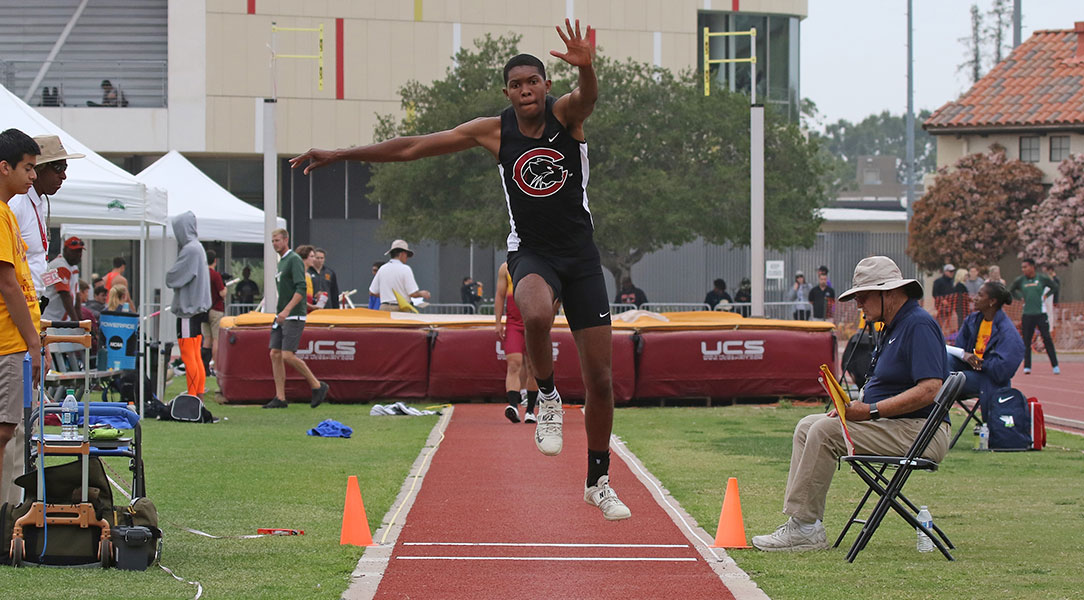 Armond Gray jumps in the triple jump.