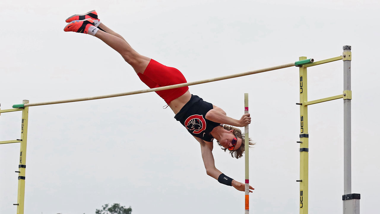 Jesse McMillan goes over the bar in the pole vault.