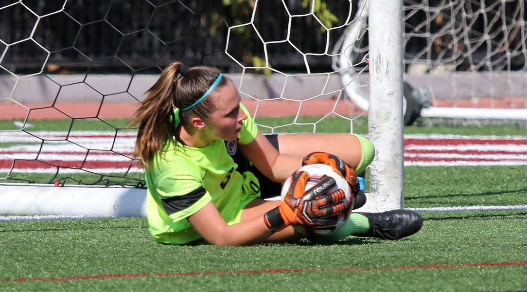 Kelsey Bland makes a diving save.
