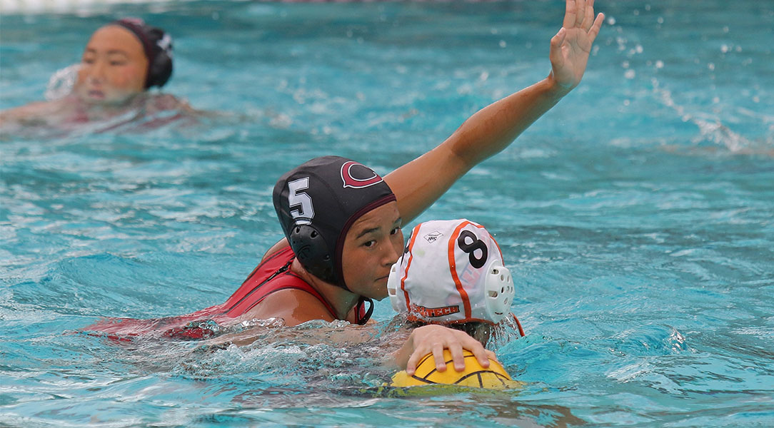 Audrey Hattori defends in water polo.