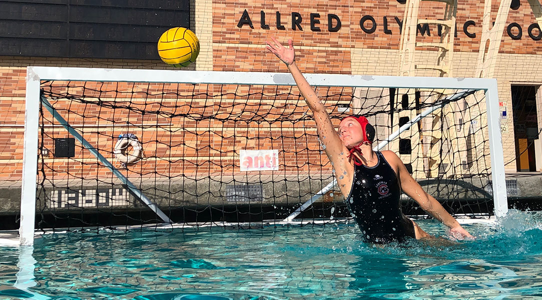 Sophia Salstrom reaches to block a shot in the pool.