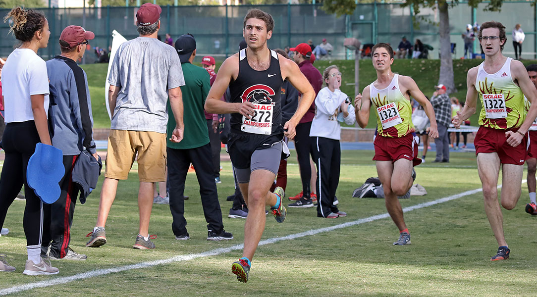 Drake Butler finishes the SCIAC Championship race.