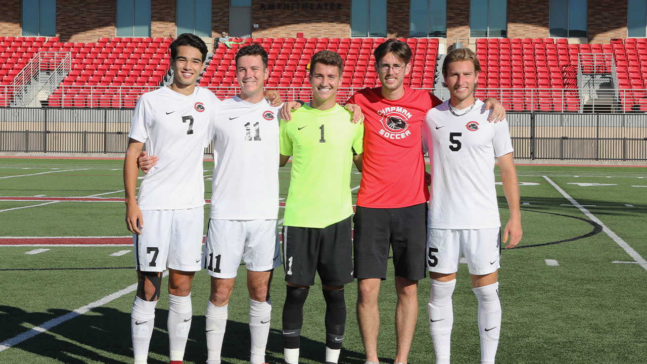 The graduating men's soccer class of 2021 poses for a photo 