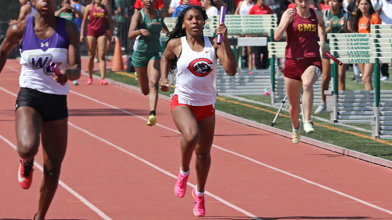Khyra Stiner sprinting toward the finish line for the 4 by 100 meter relay.