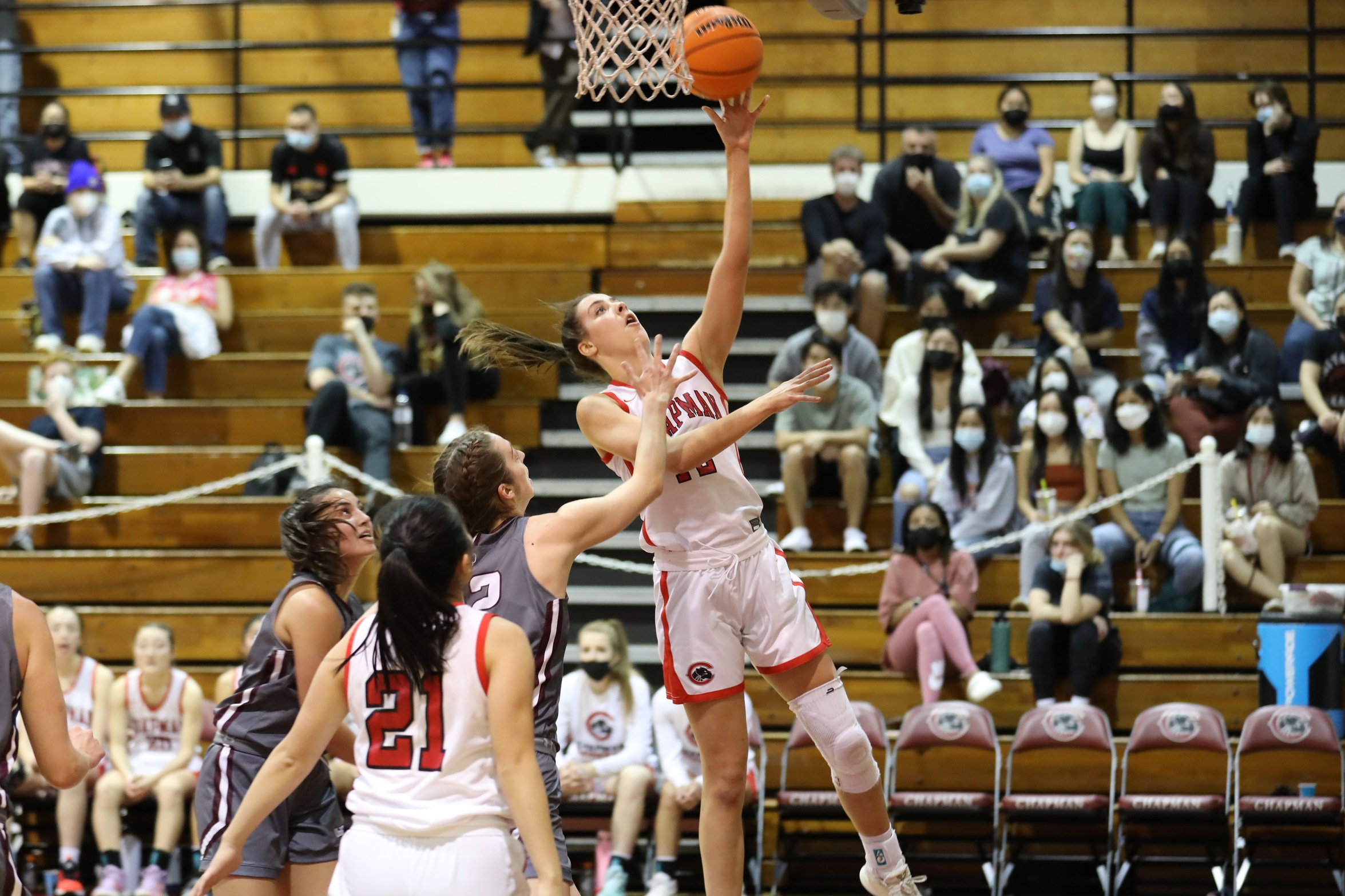 Julia Strand jumps up to the basket with the basketball 