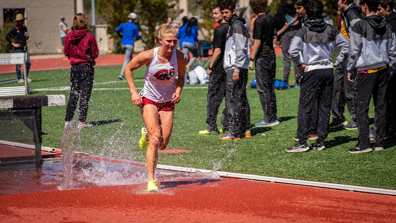 Annika Carlson runs out of the water during the steeplechase.